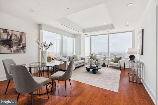 50 S 16th St Unit 4507, Philadelphia, PA 19102 - dining space with a tray ceiling, wood finished floors, recessed lighting, and floor to ceiling windows