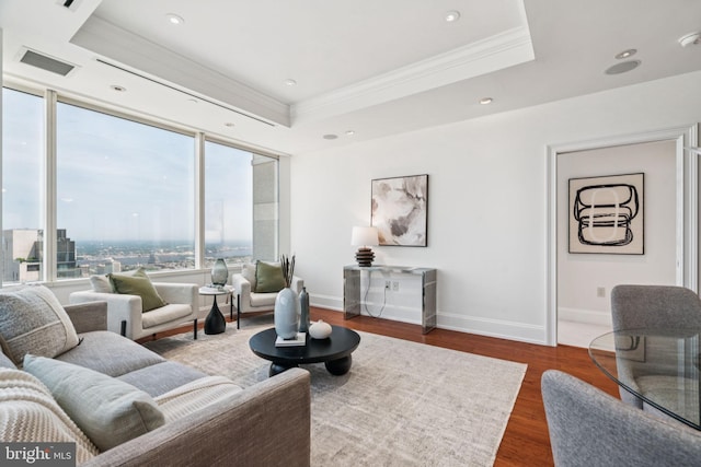 50 S 16th St Unit 4507, Philadelphia, PA 19102 - living area with crown molding, plenty of natural light, dark wood finished floors, a tray ceiling, and recessed lighting