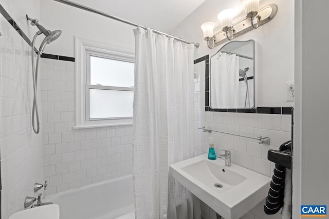 1007 Saint Charles Ave, Charlottesville, VA 22901 - bathroom featuring shower / bath combo, tile walls, and a sink
