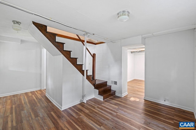 1007 Saint Charles Ave, Charlottesville, VA 22901 - finished basement with wood finished floors, stairway, and baseboards