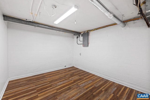 1007 Saint Charles Ave, Charlottesville, VA 22901 - finished below grade area featuring electric panel, dark wood-style floors, baseboards, and concrete block wall
