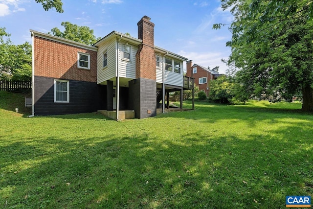 1007 Saint Charles Ave, Charlottesville, VA 22901 - back of property with a chimney and a yard