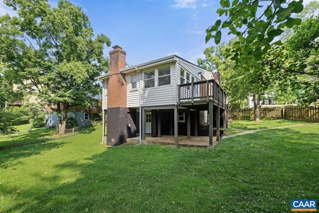 1007 Saint Charles Ave, Charlottesville, VA 22901 - rear view of house with a chimney, a wooden deck, and a patio