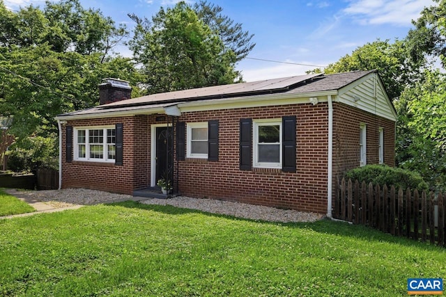 1007 Saint Charles Ave, Charlottesville, VA 22901 - view of front facade with a chimney, roof mounted solar panels, and brick siding