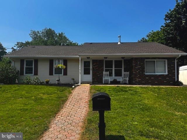 23 Terrace Ave, New Egypt, NJ 08533 - ranch-style house with a front lawn, a porch, and brick siding