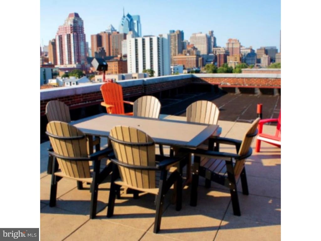 1201-15 Fitzwater St Unit 204, Philadelphia, PA 19147 - view of patio featuring a skyline view and outdoor dining area