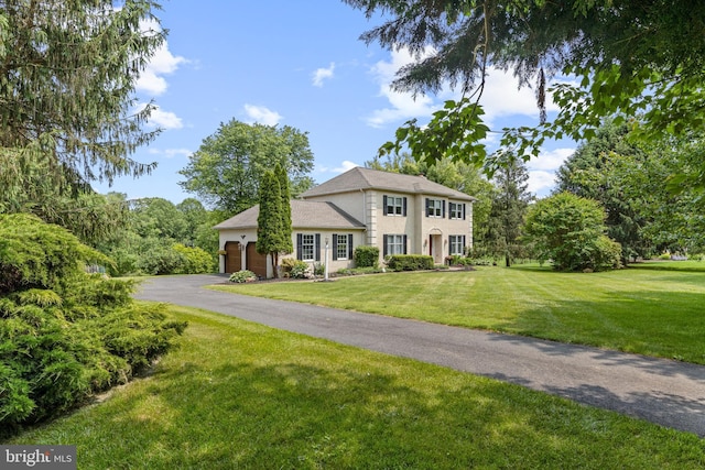 108 Partridge Way, Landenberg, PA 19350 - colonial-style house with a front lawn, an attached garage, and asphalt driveway