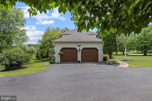 108 Partridge Way, Landenberg, PA 19350 - view of side of property with roof with shingles, a yard, stucco siding, and asphalt driveway