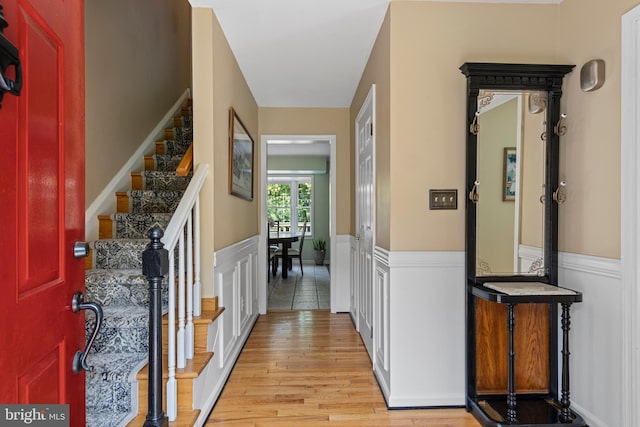 108 Partridge Way, Landenberg, PA 19350 - foyer featuring a wainscoted wall, light wood-style floors, stairs, and a decorative wall