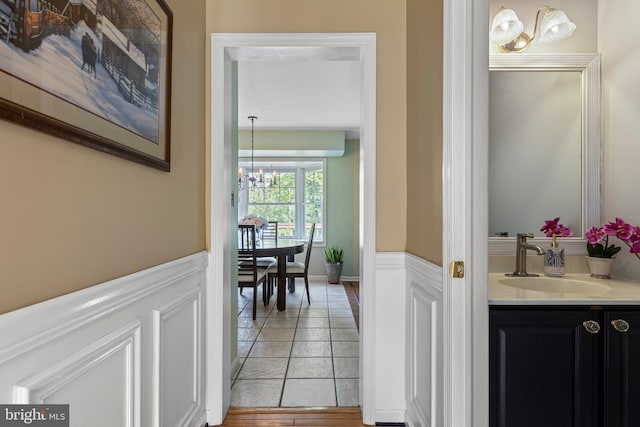108 Partridge Way, Landenberg, PA 19350 - corridor with a chandelier and a wainscoted wall