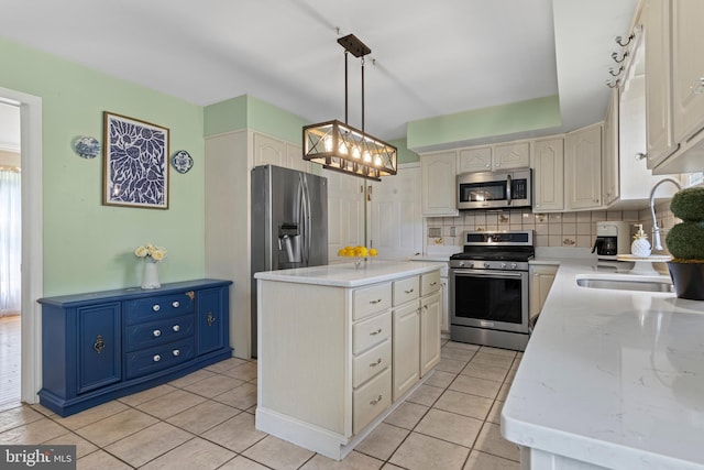 108 Partridge Way, Landenberg, PA 19350 - kitchen with appliances with stainless steel finishes, backsplash, a kitchen island, and light tile patterned floors