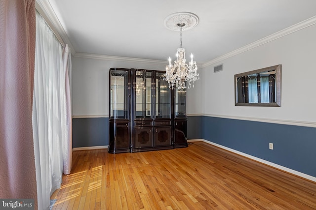 108 Partridge Way, Landenberg, PA 19350 - empty room featuring a chandelier, hardwood / wood-style floors, and ornamental molding