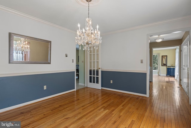 108 Partridge Way, Landenberg, PA 19350 - empty room with a chandelier, hardwood / wood-style floors, and crown molding