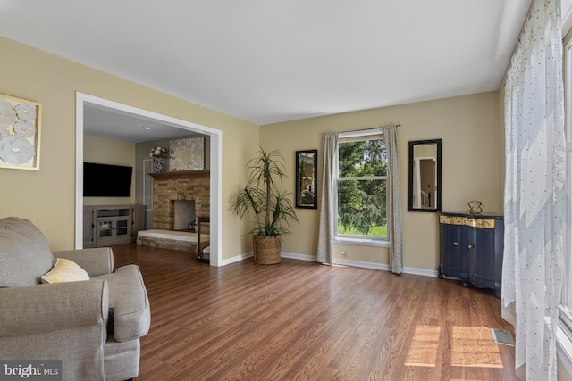 108 Partridge Way, Landenberg, PA 19350 - living room featuring a brick fireplace and wood finished floors