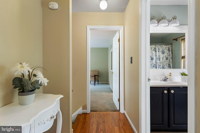 108 Partridge Way, Landenberg, PA 19350 - corridor featuring wood finished floors and a sink