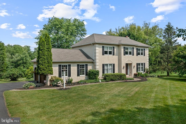 108 Partridge Way, Landenberg, PA 19350 - colonial home with a front lawn, stucco siding, driveway, and a garage