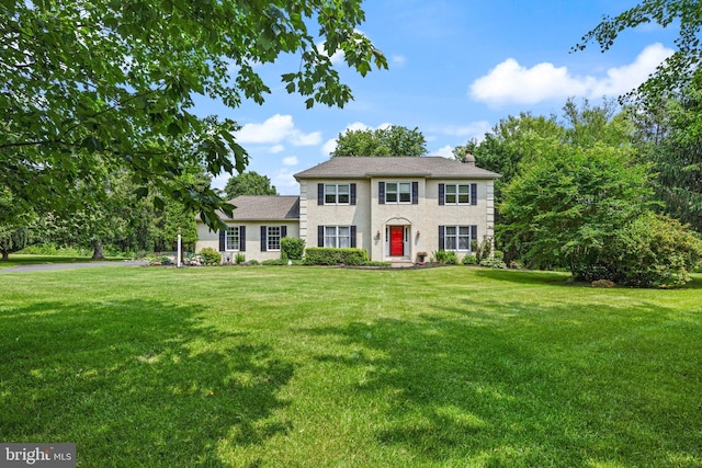 108 Partridge Way, Landenberg, PA 19350 - colonial-style house featuring a front yard, a chimney, and stucco siding