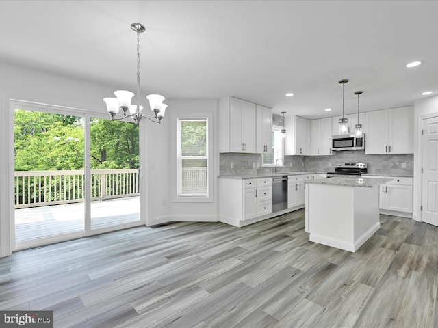1026 Indian Dr, Auburn, PA 17922 - kitchen featuring appliances with stainless steel finishes, white cabinets, backsplash, a chandelier, and recessed lighting