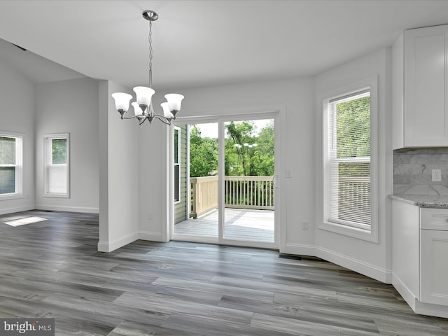 1026 Indian Dr, Auburn, PA 17922 - unfurnished dining area featuring a chandelier, baseboards, and wood finished floors