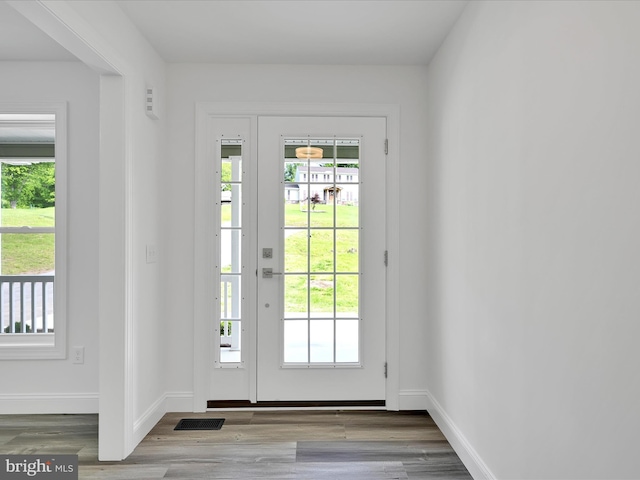 1026 Indian Dr, Auburn, PA 17922 - doorway to outside featuring wood finished floors and baseboards