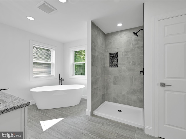 1026 Indian Dr, Auburn, PA 17922 - full bath with a tile shower, a freestanding tub, vanity, baseboards, and recessed lighting