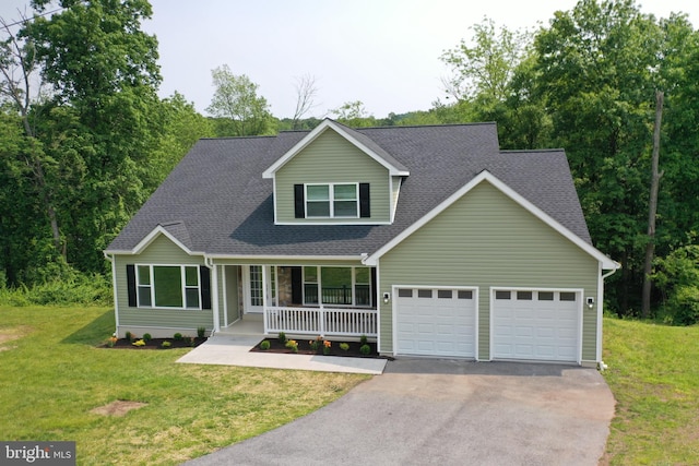1026 Indian Dr, Auburn, PA 17922 - traditional-style house featuring covered porch, an attached garage, asphalt driveway, a front yard, and roof with shingles