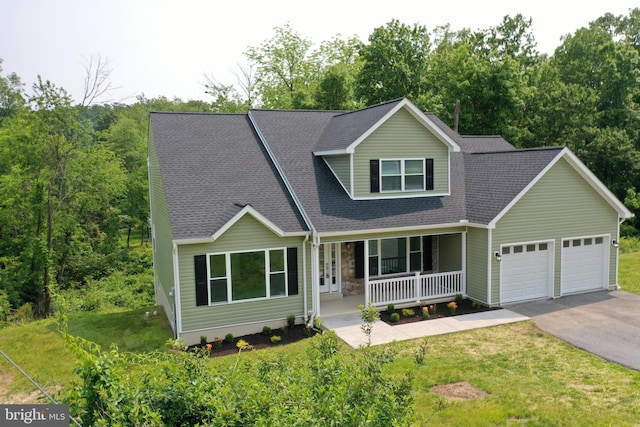 1026 Indian Dr, Auburn, PA 17922 - view of front of home with a porch, driveway, a garage, a front lawn, and a shingled roof