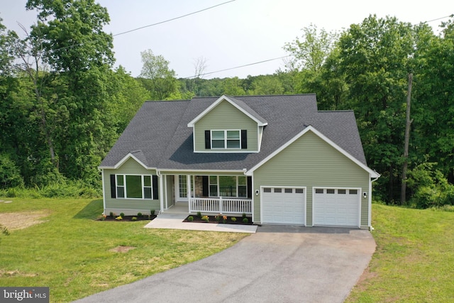 1026 Indian Dr, Auburn, PA 17922 - view of front of home featuring driveway, an attached garage, a porch, a front lawn, and a shingled roof