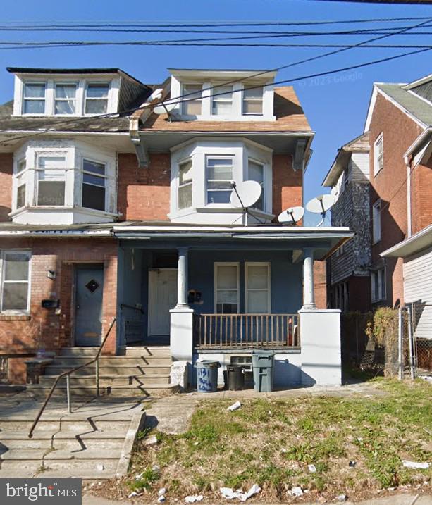 1131 W Rockland St, Philadelphia, PA 19141 - townhome / multi-family property featuring covered porch and brick siding