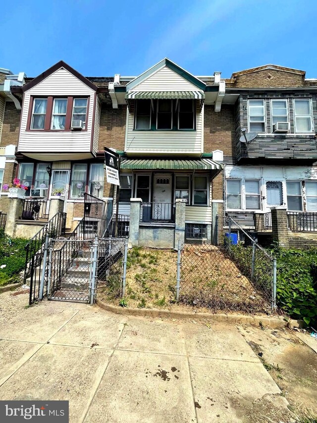 6065 Chester Ave, Philadelphia, PA 19142 - view of property with covered porch, a gate, and a fenced front yard