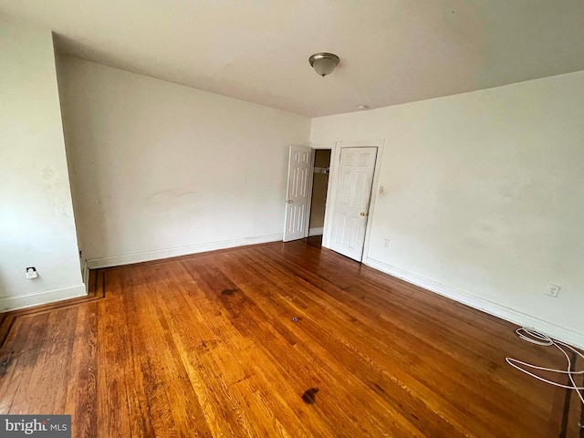 6065 Chester Ave, Philadelphia, PA 19142 - empty room with wood finished floors and baseboards