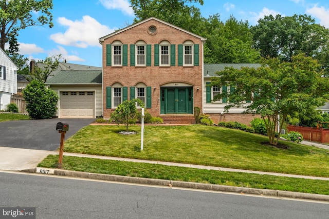 8017 Lake Pleasant Dr, Springfield, VA 22153 - view of front of property featuring asphalt driveway, an attached garage, and brick siding
