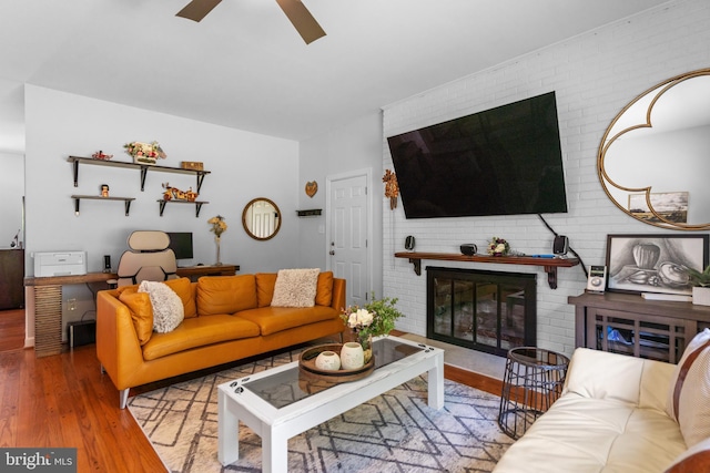 8017 Lake Pleasant Dr, Springfield, VA 22153 - living area with a fireplace, wood finished floors, a ceiling fan, and an office area