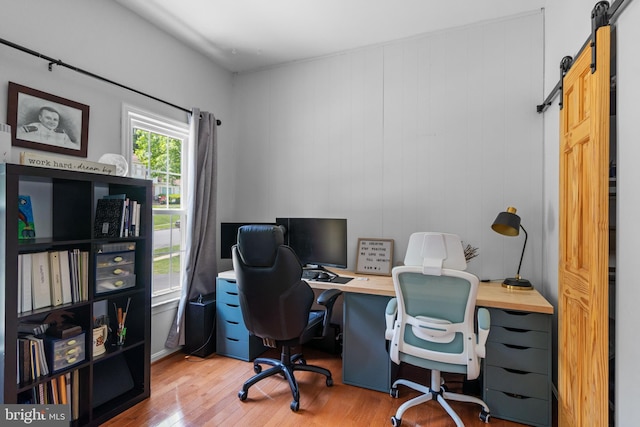 8017 Lake Pleasant Dr, Springfield, VA 22153 - home office with a barn door and wood finished floors
