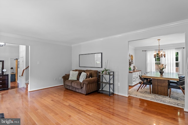 8017 Lake Pleasant Dr, Springfield, VA 22153 - living room featuring a chandelier, ornamental molding, light wood-type flooring, stairs, and baseboards