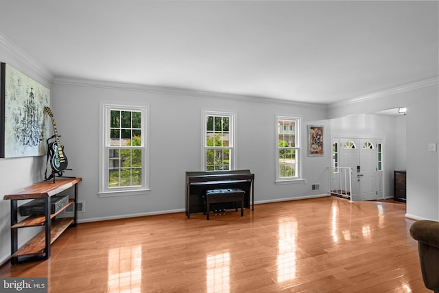 8017 Lake Pleasant Dr, Springfield, VA 22153 - foyer with ornamental molding, wood finished floors, and baseboards