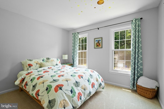 8017 Lake Pleasant Dr, Springfield, VA 22153 - carpeted bedroom with baseboards and multiple windows