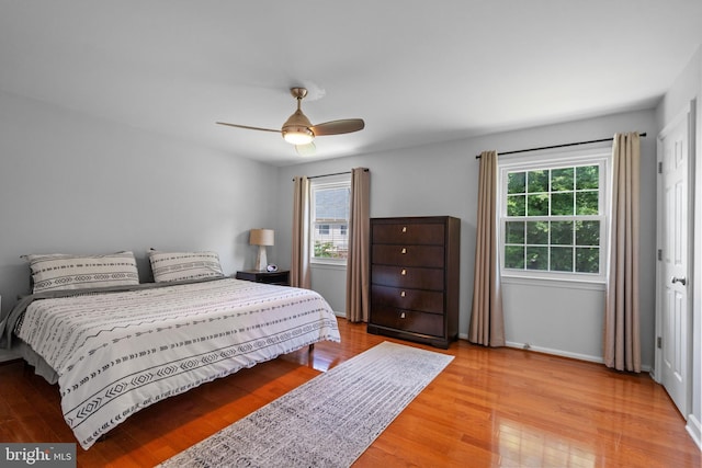 8017 Lake Pleasant Dr, Springfield, VA 22153 - bedroom featuring multiple windows, wood finished floors, and baseboards