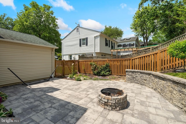8017 Lake Pleasant Dr, Springfield, VA 22153 - fenced backyard featuring an outdoor fire pit and a patio