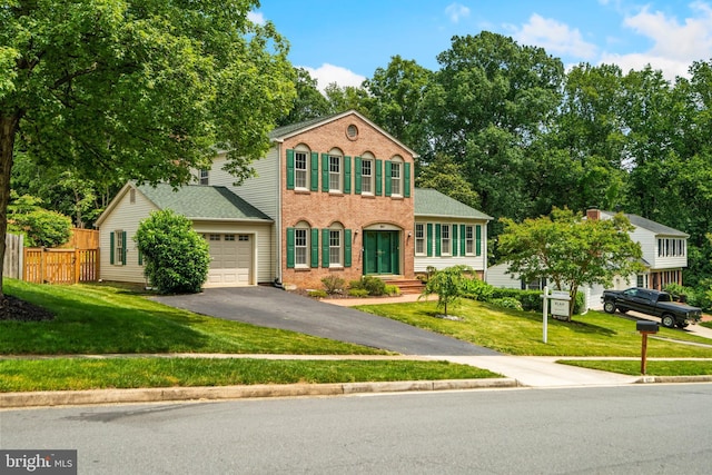 8017 Lake Pleasant Dr, Springfield, VA 22153 - view of front facade featuring driveway, a garage, brick siding, and a shingled roof