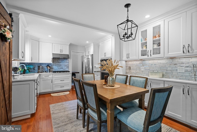 8017 Lake Pleasant Dr, Springfield, VA 22153 - dining area with a chandelier, recessed lighting, and wood finished floors