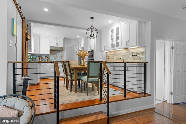 8017 Lake Pleasant Dr, Springfield, VA 22153 - dining space featuring wood finished floors, recessed lighting, a chandelier, and baseboards