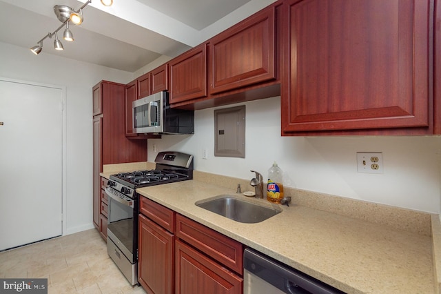 4201 Cathedral Ave NW Unit 910W, Washington, DC 20016 - kitchen featuring appliances with stainless steel finishes, electric panel, dark brown cabinets, and rail lighting