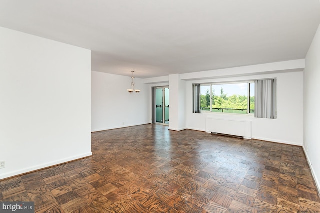 4201 Cathedral Ave NW Unit 910W, Washington, DC 20016 - spare room with baseboards and a chandelier