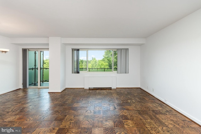 4201 Cathedral Ave NW Unit 910W, Washington, DC 20016 - spare room with radiator heating unit and baseboards