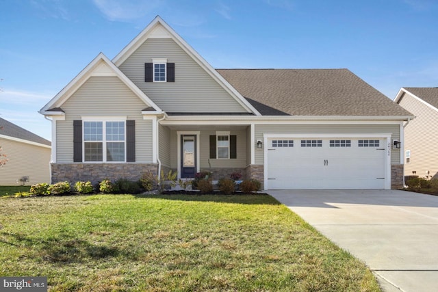 24360 Caldwell Cir, Lewes, DE 19958 - view of front facade with stone siding, a garage, concrete driveway, and a front yard