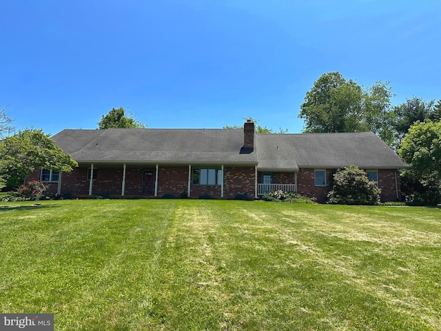 3314 Skyview Dr, Glenville, PA 17329 - view of front of property featuring a front lawn, brick siding, and a chimney