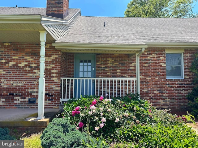 3314 Skyview Dr, Glenville, PA 17329 - view of side of home featuring brick siding, a chimney, and a shingled roof