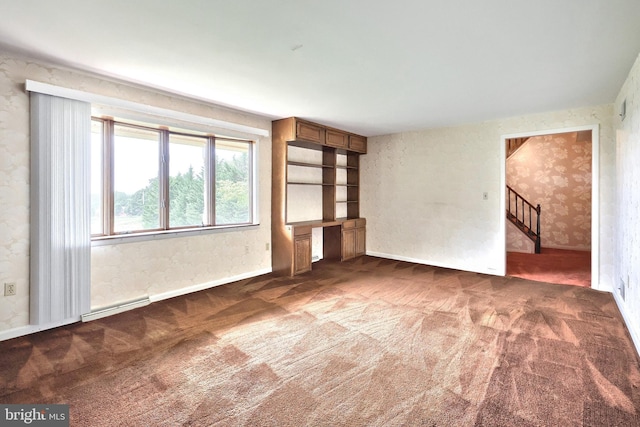 3314 Skyview Dr, Glenville, PA 17329 - unfurnished living room featuring carpet floors, wallpapered walls, stairs, and a baseboard heating unit