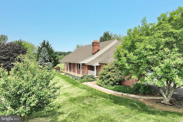3314 Skyview Dr, Glenville, PA 17329 - view of front of home featuring a front lawn, brick siding, and a chimney